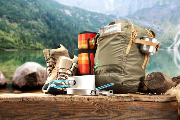 Camping checklist equipment including bag, pots, pans and hiking shoes