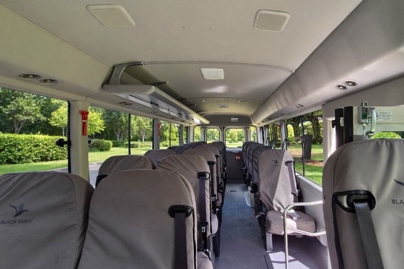 Inside the Toyota Coaster bus showing 21 passenger seats