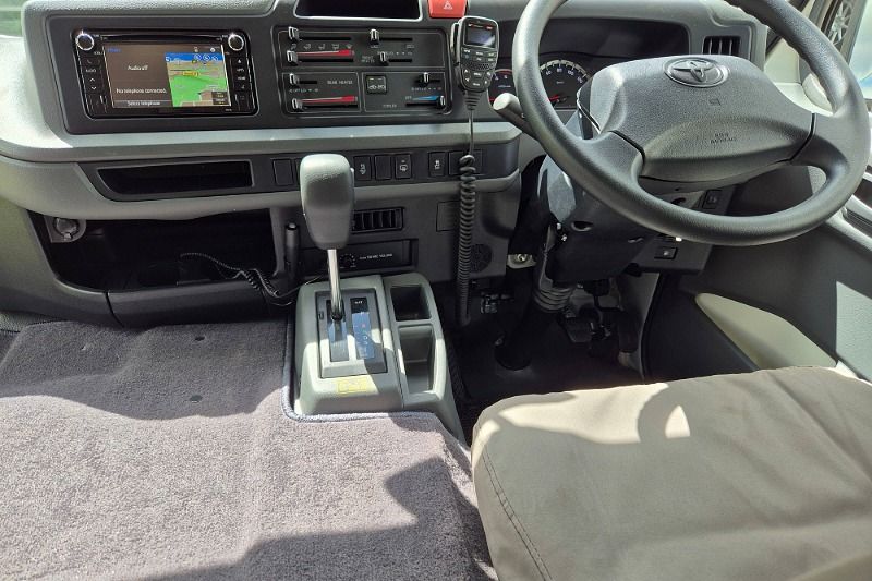 The driving cab and dash for the Toyota Coaster Bus