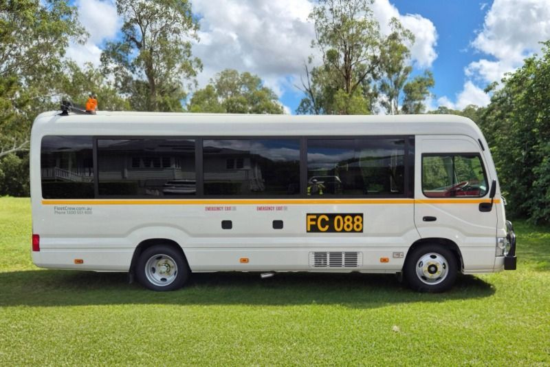 22 seater Toyota Coaster Bus profile view