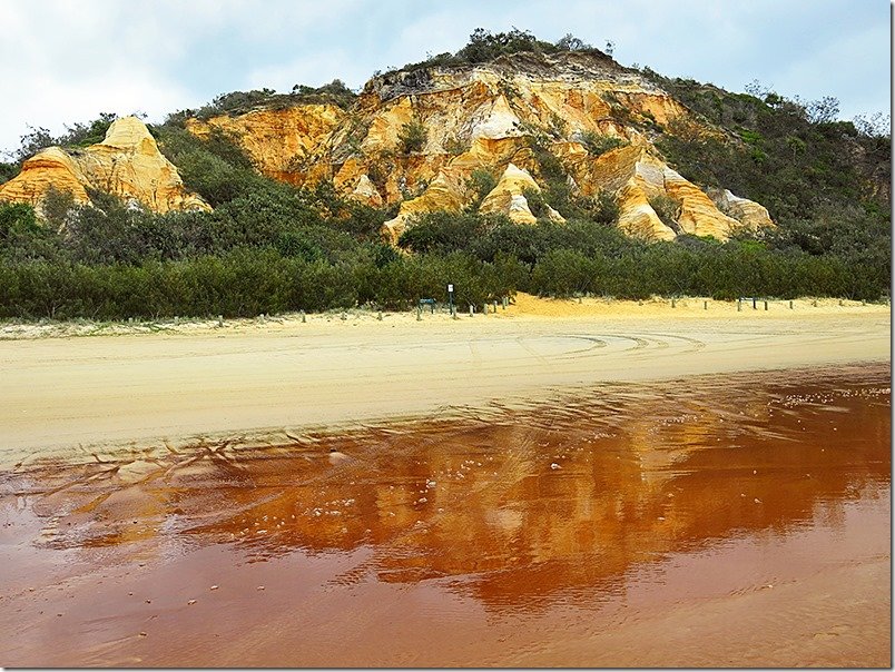 view of colorful sand and cliffs at the pinnacles