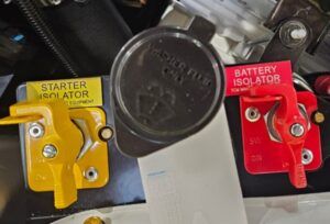 Yellow Starter Motor Isolator switch next to Red Battery Isolator Jump Start Receptacle switch