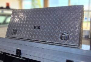 Large metal tool box fitted to the tray of a ute